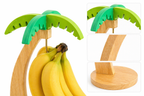Palm tree-shaped banana holder with bananas on a white background