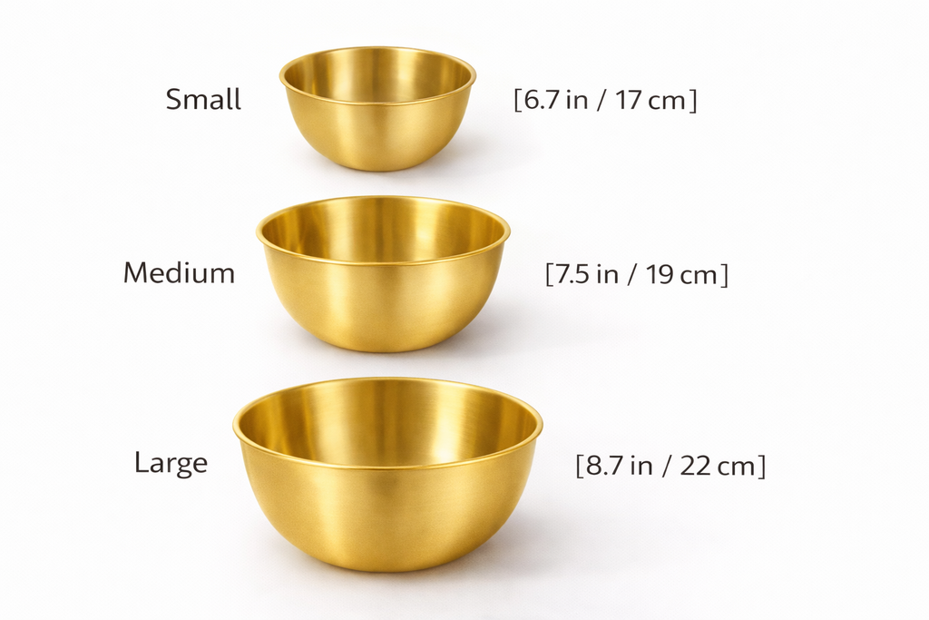 Three gold bowls of different sizes with measurements on a white background