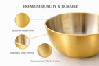 Gold mixing bowl with stainless steel interior, measurement marks, and labeled features on a white background.