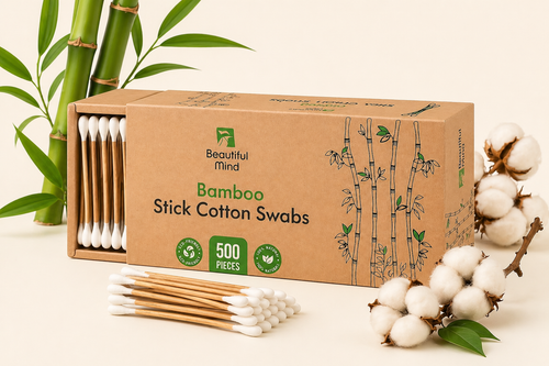 Box of Bamboo Stick Cotton Swabs with cotton and bamboo elements on a light background