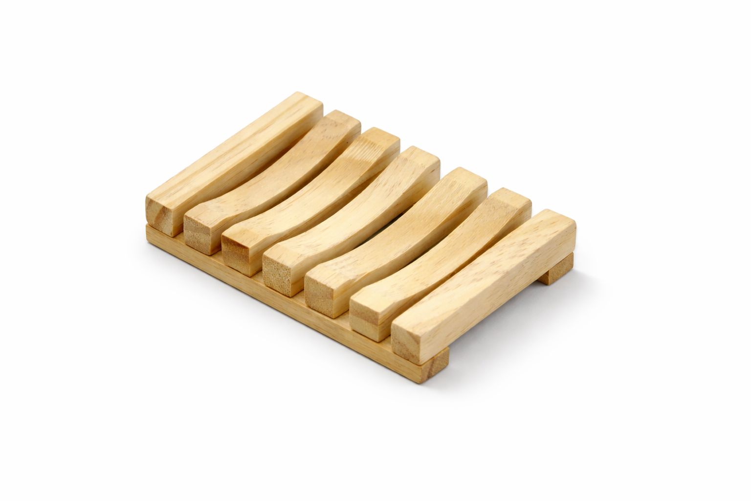 Wooden soap dish with five rectangular bars on a white background